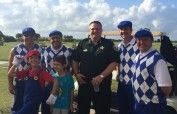 Members of Widerman Malek pictured with [url=http://www.brevardsheriff.com/home/meet-the-sheriff-wayne-ivey/]Sheriff Wayne Ivey[/url]. Mark Malek’s sons were caddies for the event.