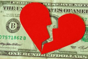 Broken Heart over Money Showing a Business Break Up