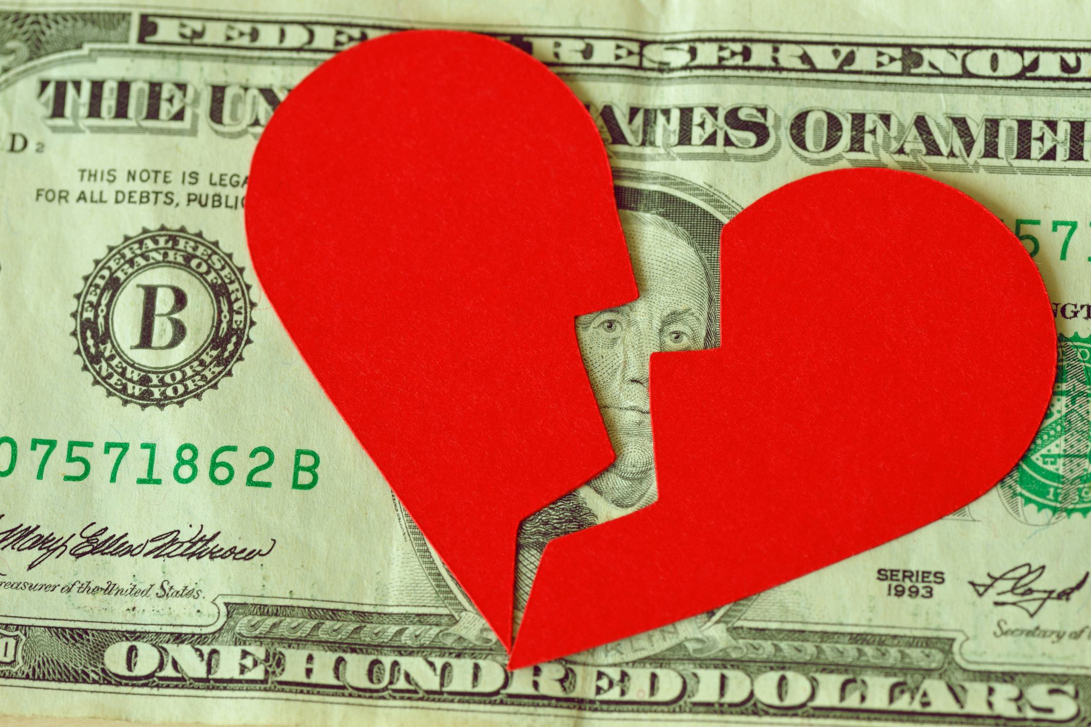 Broken Heart over Money Showing a Business Break Up